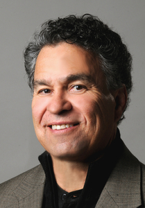 headshot of professor Génaro M. Padilla smiling at camera