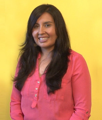 headshot of professor Cristina Mora smiling at camera