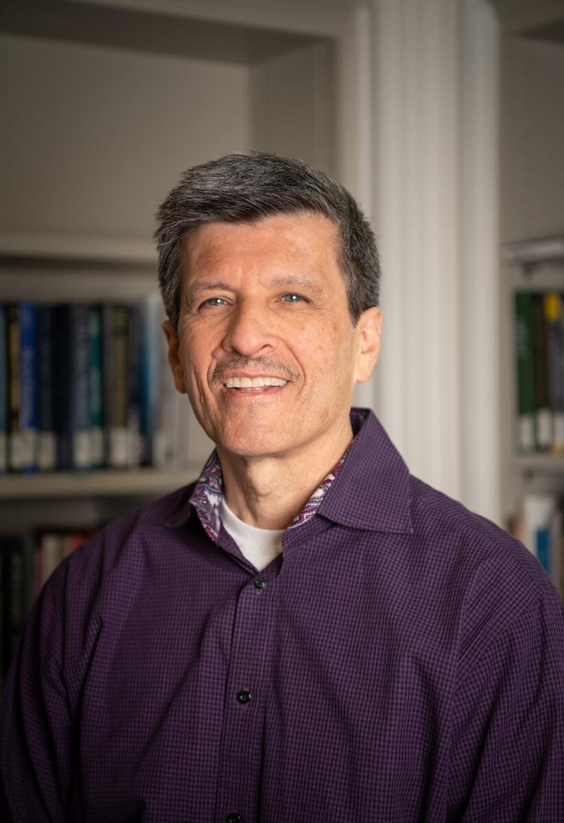 headshot of professor kurt organista smiling at camera